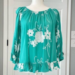 EUC teal green 3/4 sleeve top with stitched white flowers.